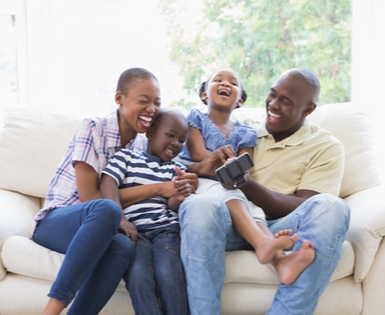 Happy family using MetLife Homeowners Insurance Happy family using MetLife Homeowners Insurance