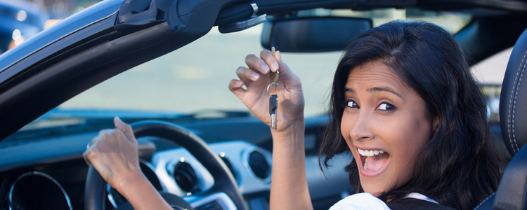 Happy woman purchasing new car
