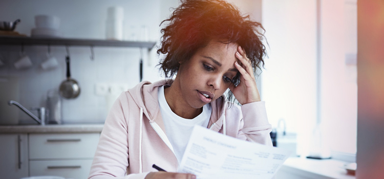 Young woman stressed over bills